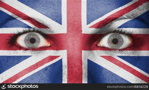 Close up of eyes. Painted face with flag of United Kingdom