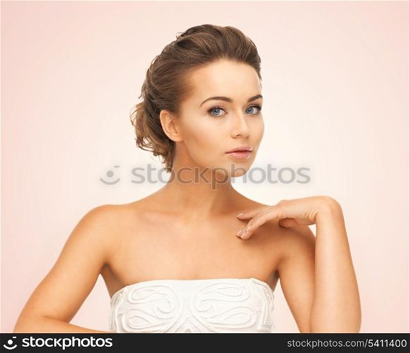 close up of face and hands of beautiful young woman