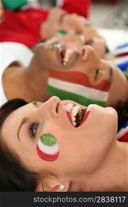 close up of faces of joyful italian soccer supporters