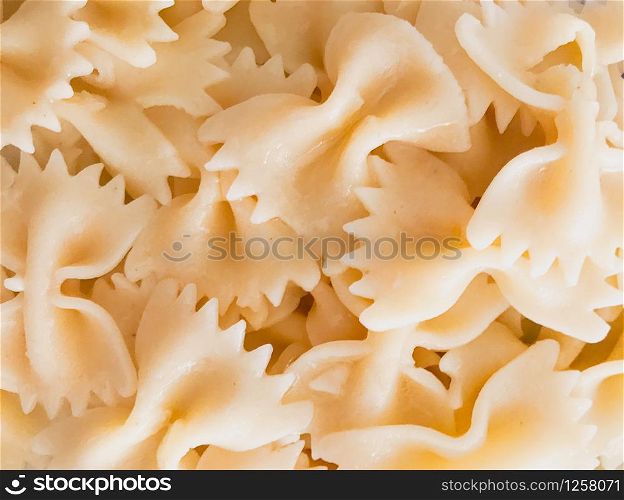 Close up of farfalle pasta background. Farfalle are a type of pasta/noodle commonly known as bow-tie pasta or butterfly pasta.
