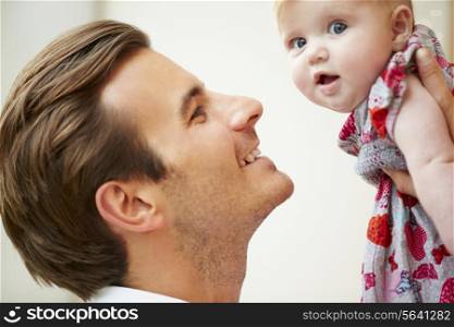 Close Up Of Father Holding Baby Daughter