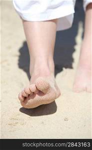 close-up of feet in the sand