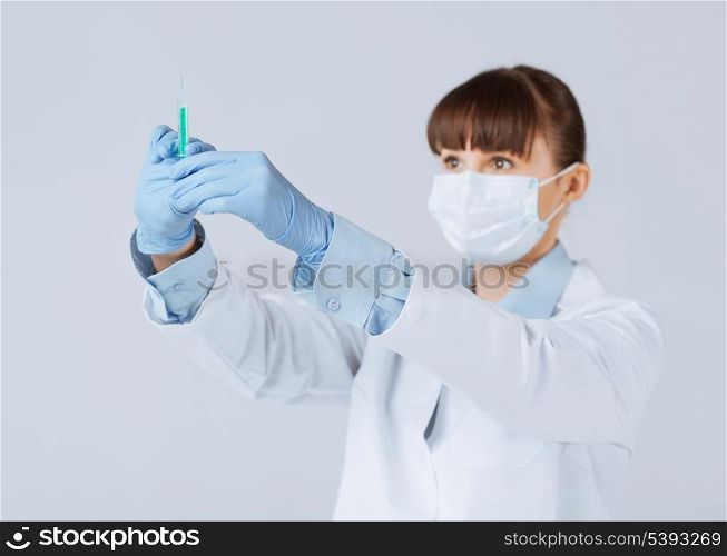 close up of female doctor holding syringe with injection