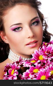 Close-up of female face with pink chrysanthemum. Wedding concept.