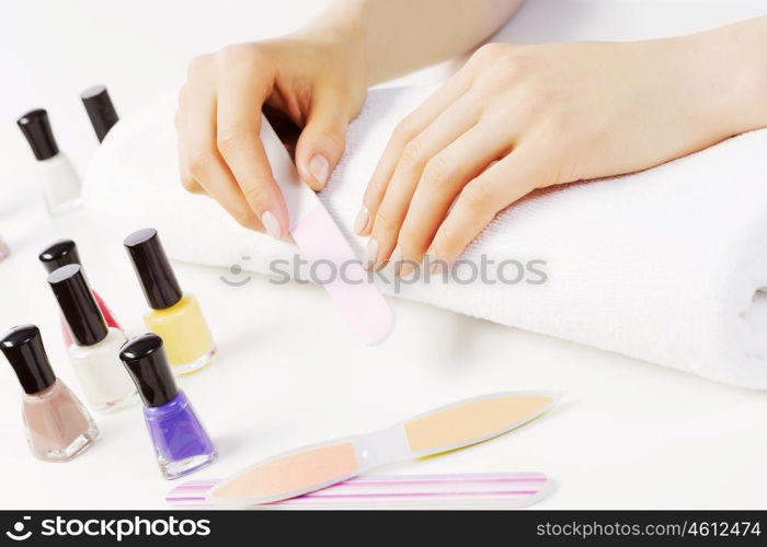 Close up of female hands making manicure