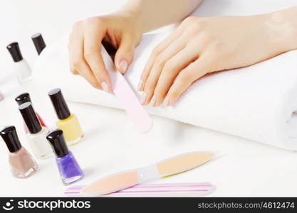 Close up of female hands making manicure