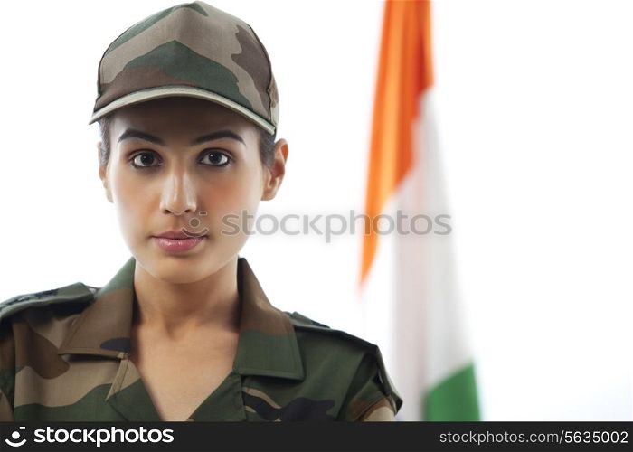 Close-up of female soldier in front of Indian flag