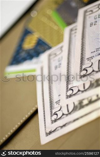 Close-up of fifty dollar bills and credit cards