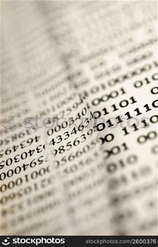 Close-up of financial figures with binary code