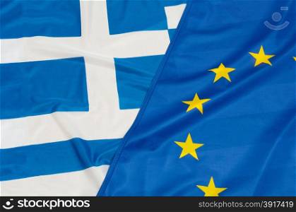 Close up of flags of European Union and Greece