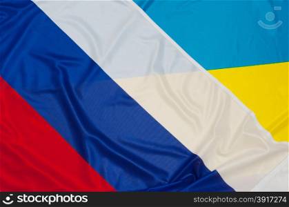 Close up of flags of Ukraine and Russia