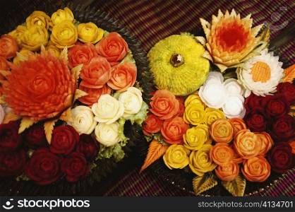 Close-up of flowers carved from vegetables