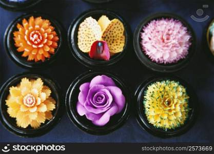Close-up of flowers carved on soaps