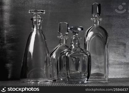 Close-up of four empty perfume bottles