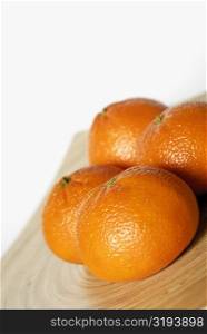 Close-up of four oranges