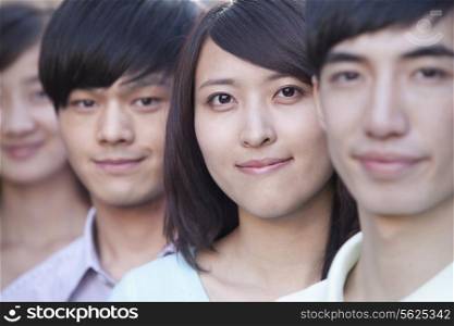 Close Up of Four Young People Standing in a Row in Beijing
