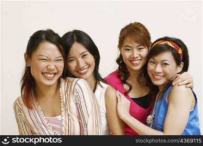 Close-up of four young women posing