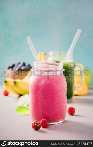 Close-up of fresh smoothie with fruits and berries, selective focus. Detox, dieting, clean eating, vegetarian, vegan, fitness, healthy lifestyle concept