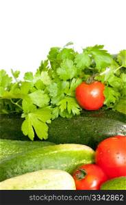 Close Up of Fresh Vegetables on White Background - Tomatoes, Cucumbers, Zucchinis and Parsley