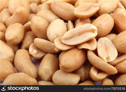 Close up of fried, peeled and salted peanuts.