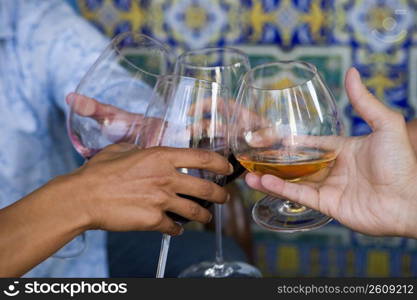 Close-up of friends toasting