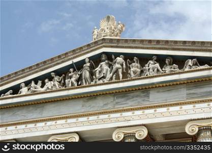 Close up of frieze of Academy of Athens in Greece. This neoclassical building is one of the major landmarks in Athens. This multiple-figured composition represents the birth of Athena with Zeus in the middle, Athena on his right and Hefestos on his left.