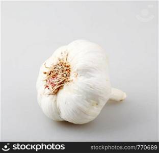 Close-Up Of Garlic Against Gray Background