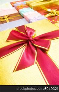 Close up of gift box with golden ribbon