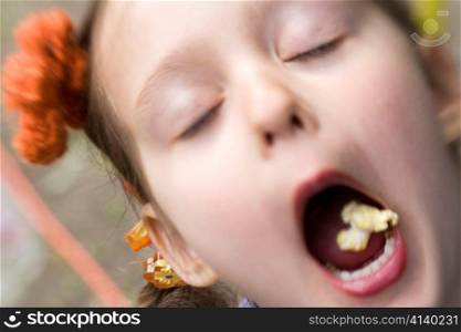 Close Up of Girl Eating Popcorn
