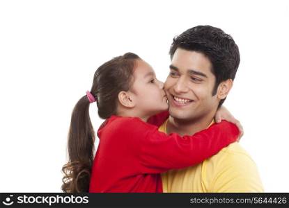 Close-up of girl kissing her father