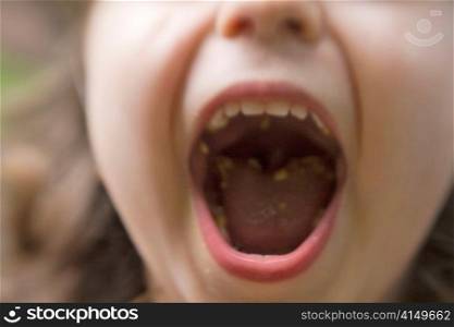 Close Up of Girl Showing Food in Mouth