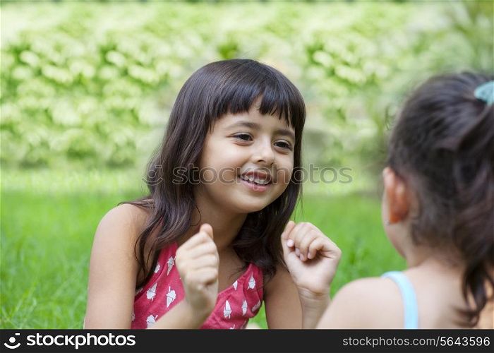 Close-up of girls talking in park