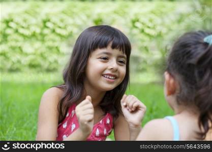 Close-up of girls talking in park