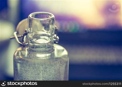 Close up of glass bottle in the office, drinking