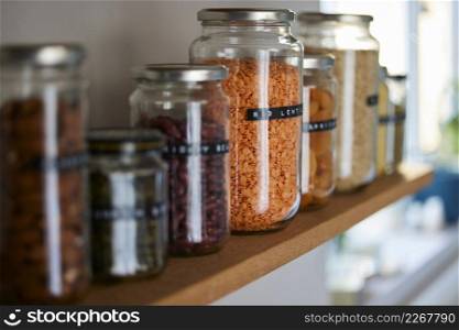 Close Up Of Glass Jars On Shelf Being Reused To Store Dried Food Living Sustainable Lifestyle At Home