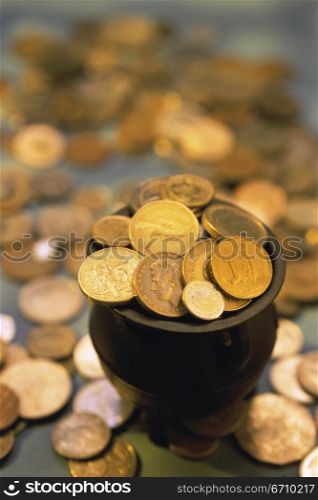 Close-up of gold coins in a pot