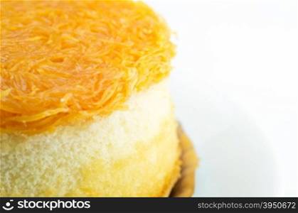 Close up of gold egg yolks thread cake on white background&#xA;