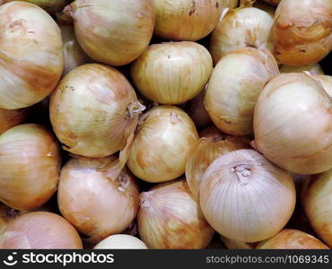 close up of golden white onions background