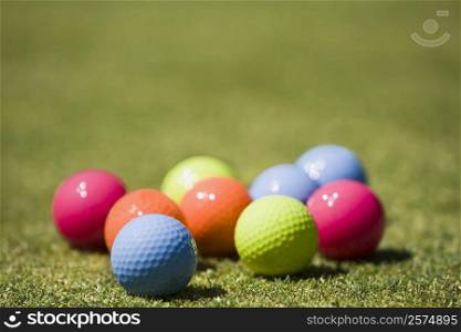 Close-up of golf balls on the grass