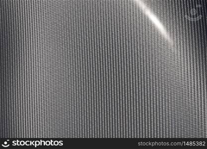 Close up of grey carbon fiber pattern texture surface. Texture and pattern background. Modern technology and material concept.