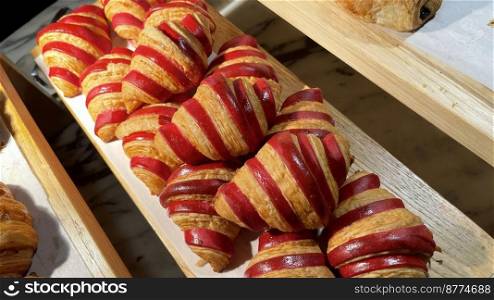 Close up of group of fresh baked delicious christmas croissants, super delicious warm fresh buttery Croissants and Rolls, French and American Croissants and baked pastries are enjoyed world wide on bakery shop, tasty multiple croissant