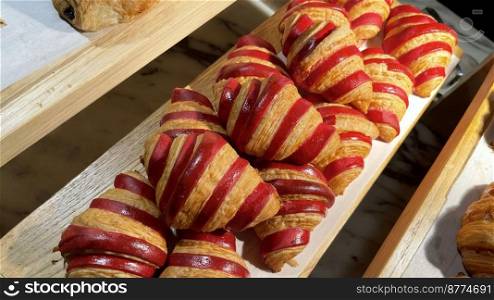 Close up of group of fresh baked delicious christmas croissants, super delicious warm fresh buttery Croissants and Rolls, French and American Croissants and baked pastries are enjoyed world wide on bakery shop, tasty multiple croissant