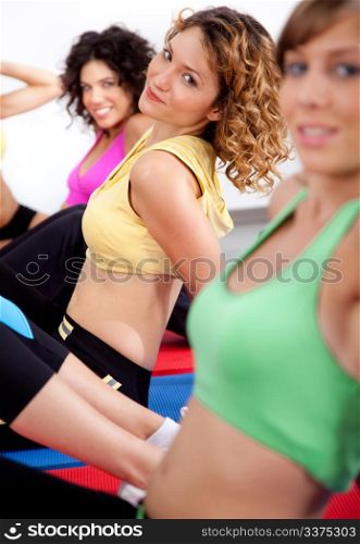 close up of group of girls working out at gym