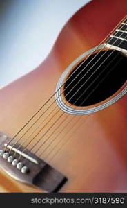 Close-up of guitar, its strings and frets