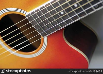 Close-up of guitar, its strings and frets