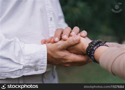 Close up of hand couple elderly holding to hand in the park