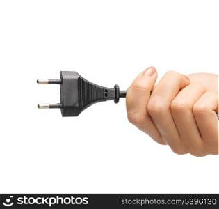 close up of hand holding black electrical plug with wire