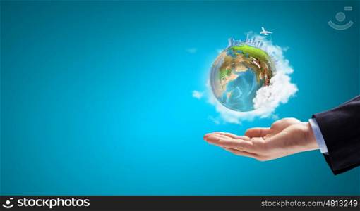 Close up of hand holding Earth planet. Elements of this image are furnished by NASA. Our planet in our hands