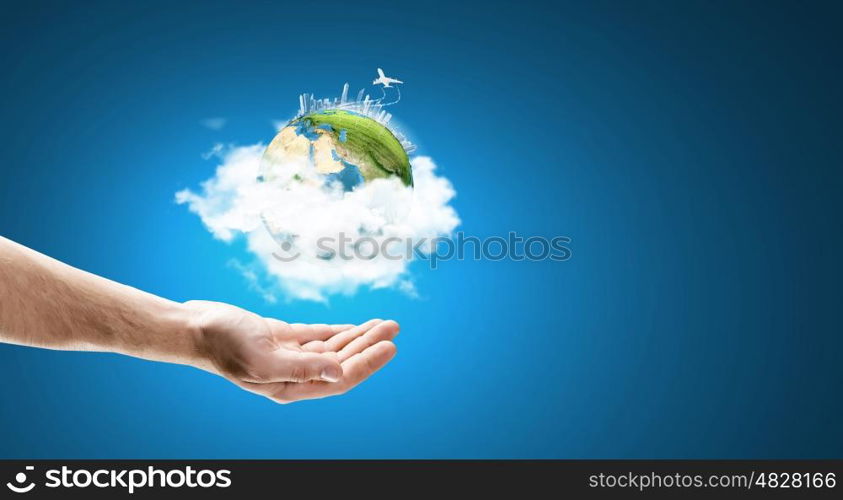 Close up of hand holding Earth planet. Elements of this image are furnished by NASA. Our planet in our hands