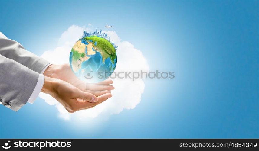 Close up of hand holding Earth planet. Elements of this image are furnished by NASA. Our planet in our hands
